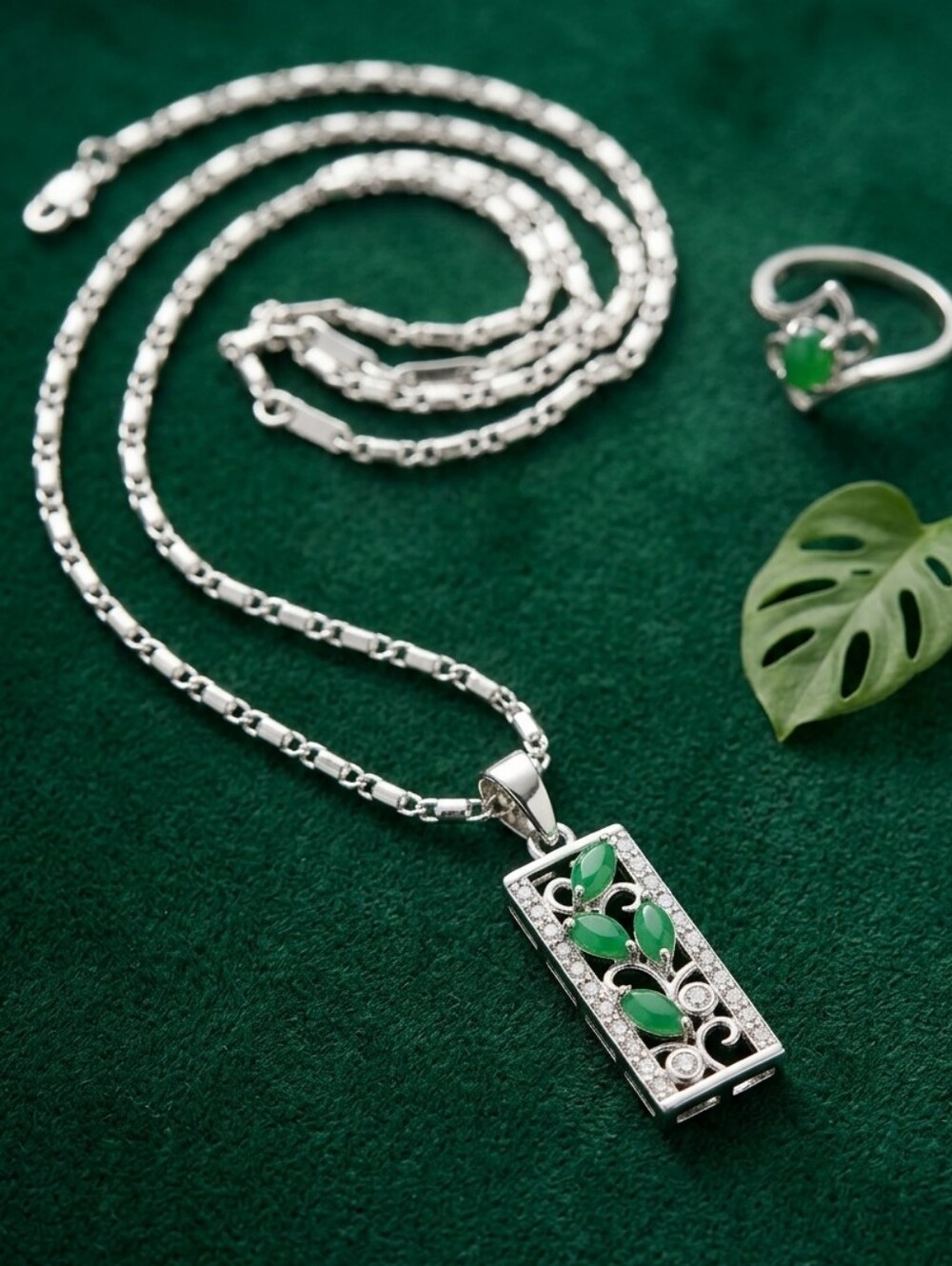 Silver Tone Pendant Necklace with Green Leaf Accents